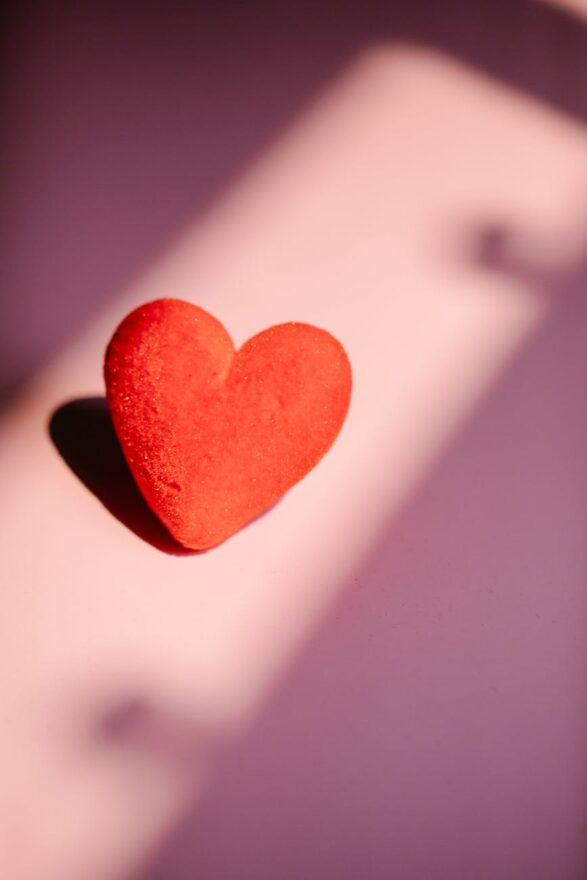 red colored hearts on pink background